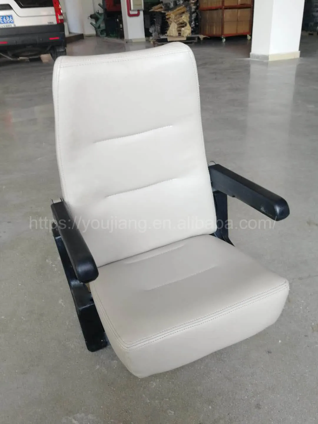 Folding ambulance seat with seat belt