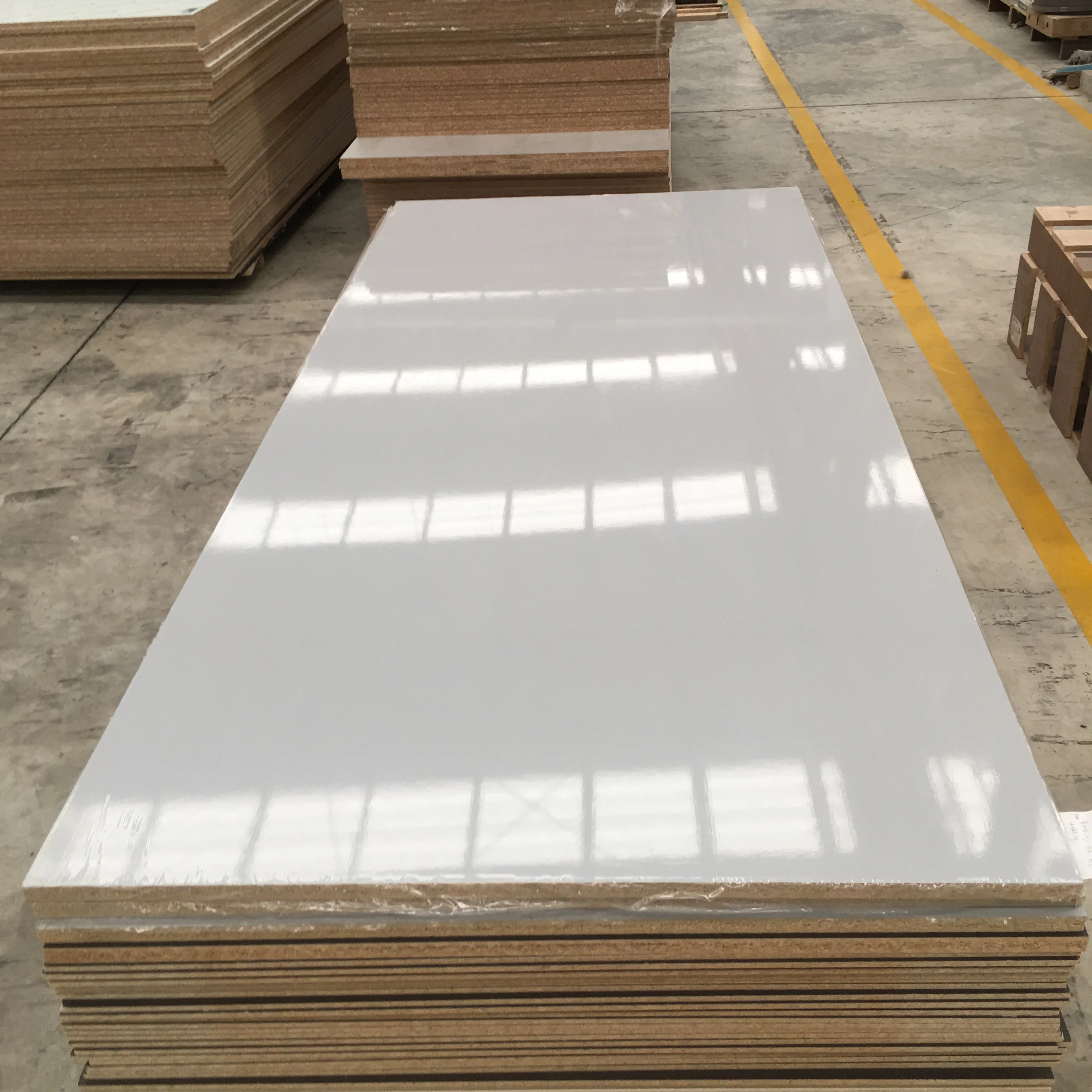 Sales E1 level 1220mmx2440mm  melamine faced high glossy uv mdf particle board