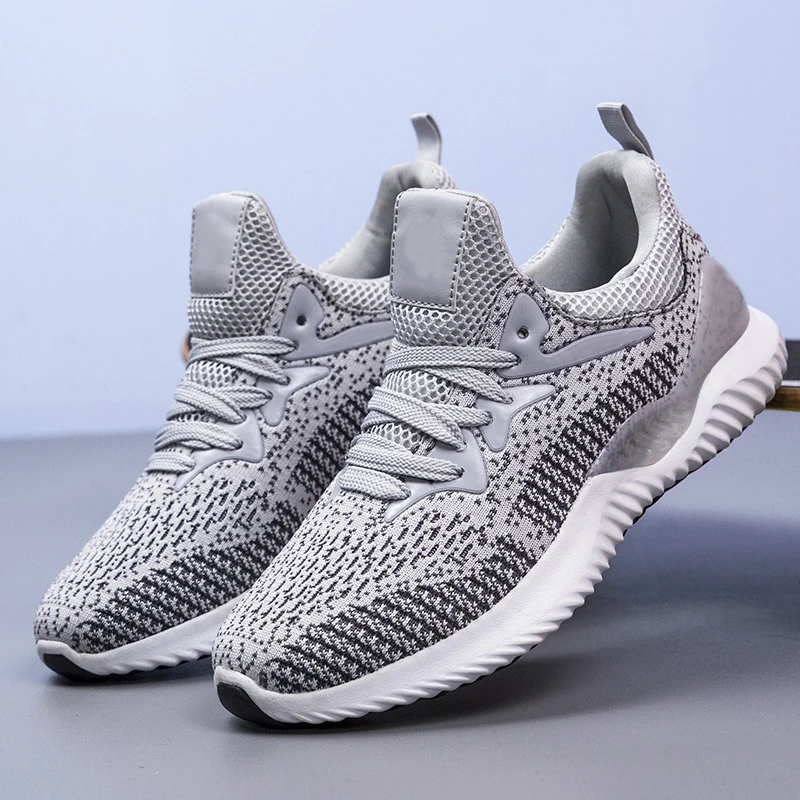 Adit Wholesale Unisex Breathable Sport Stock Couple Fashion Sneakers Customized Brand Fitness Walking Shoes Running Shoes Men