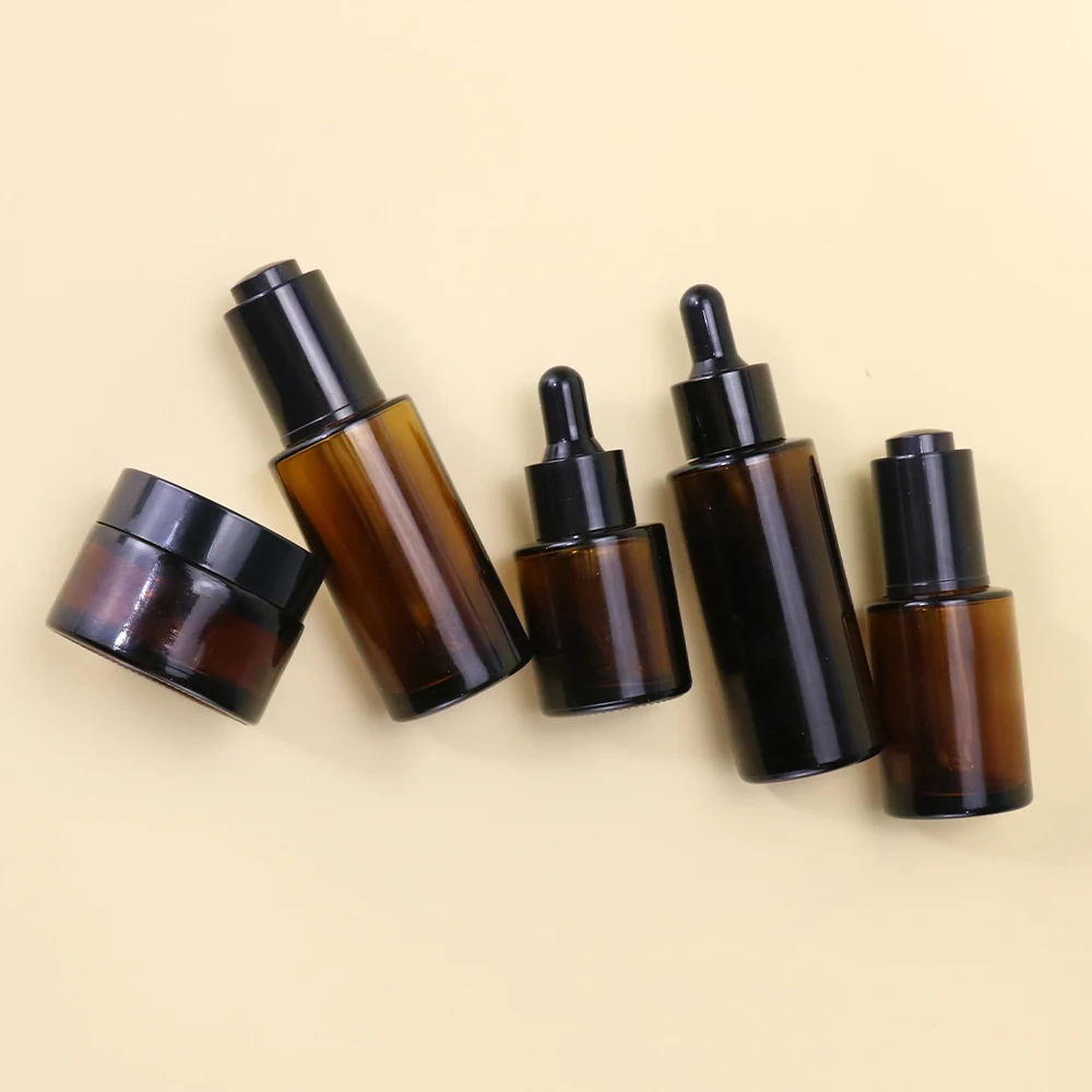 Cosmetic luxury glass spray bottle empty amber skin care glass bottle packaging set lotion pump bottle for skincare