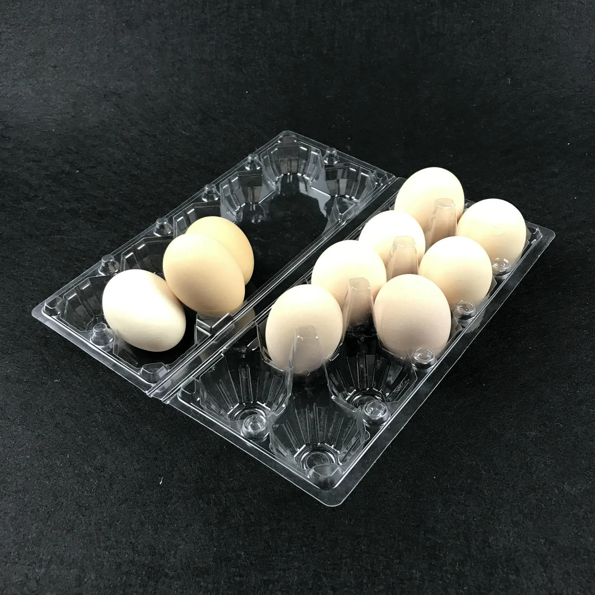 A plastic PET  egg trays egg box used by supermarkets to prevent eggs from breaking