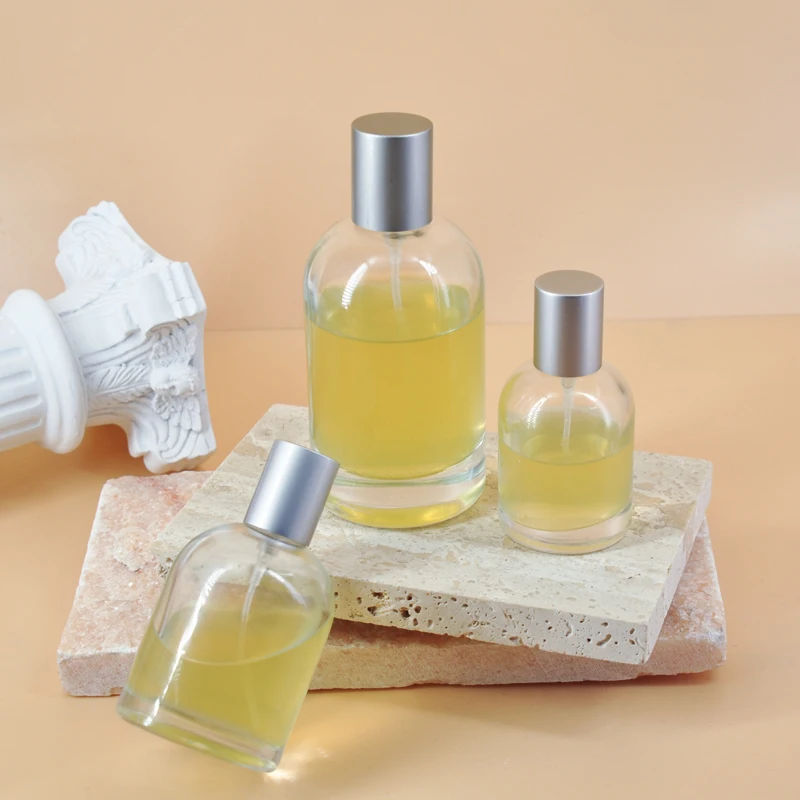 Customized logo 30ml  50ml 100ml round shape perfume glass bottle  Mist Spray Pump Glass Perfume Bottle with Silver Golden Caps