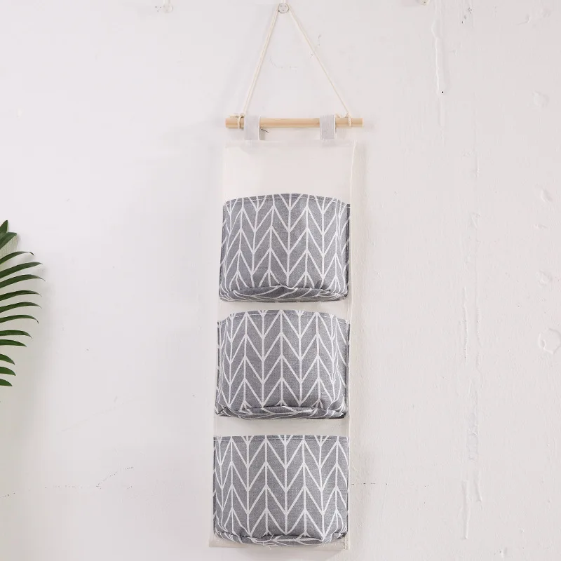 Hot selling new three pocket large dormitory wall mobile phone hanging storage student bedroom storage bag