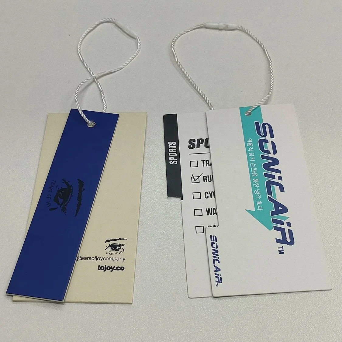 Customized luxury clothing tags clothing labels with printed name logo plastic tags with rope paper tags backpacks own logo