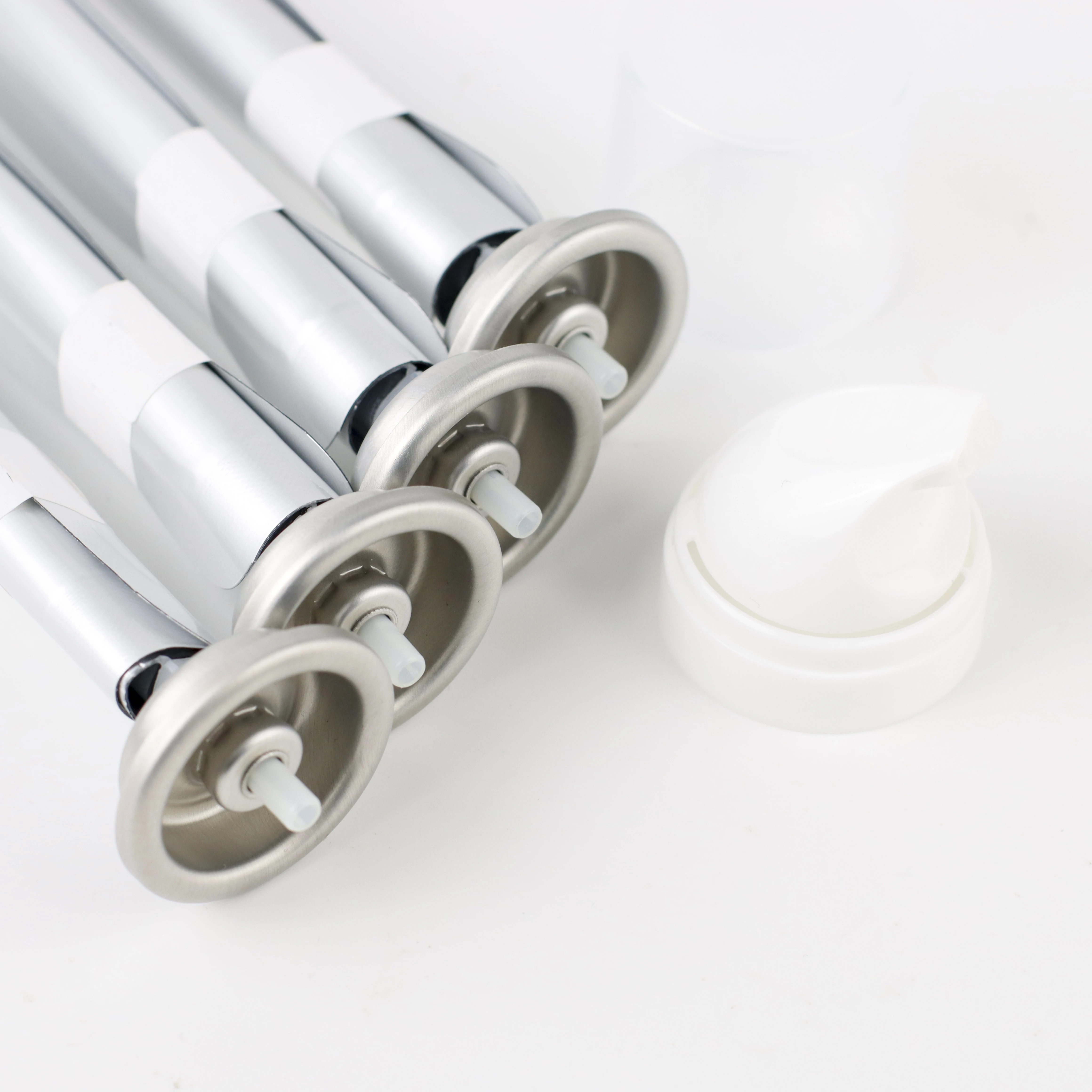 Aluminum oil can filling with pure olive oil used for cooking with olive sprayer