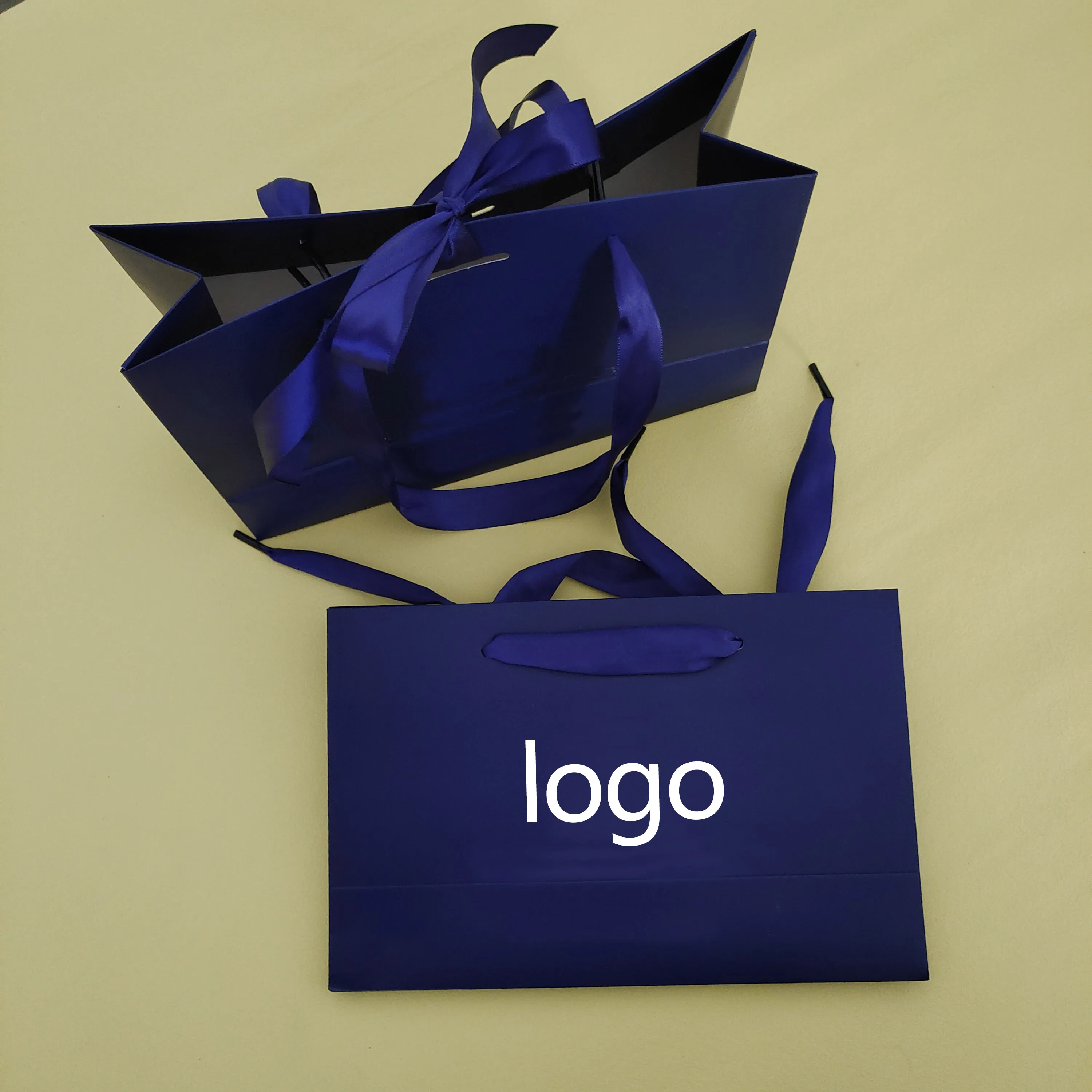 Custom Printing Logo loyal blue Shopping Bag Packaging Clothes Gifts Tote Cardboard Paper Bag With Ribbon Handle