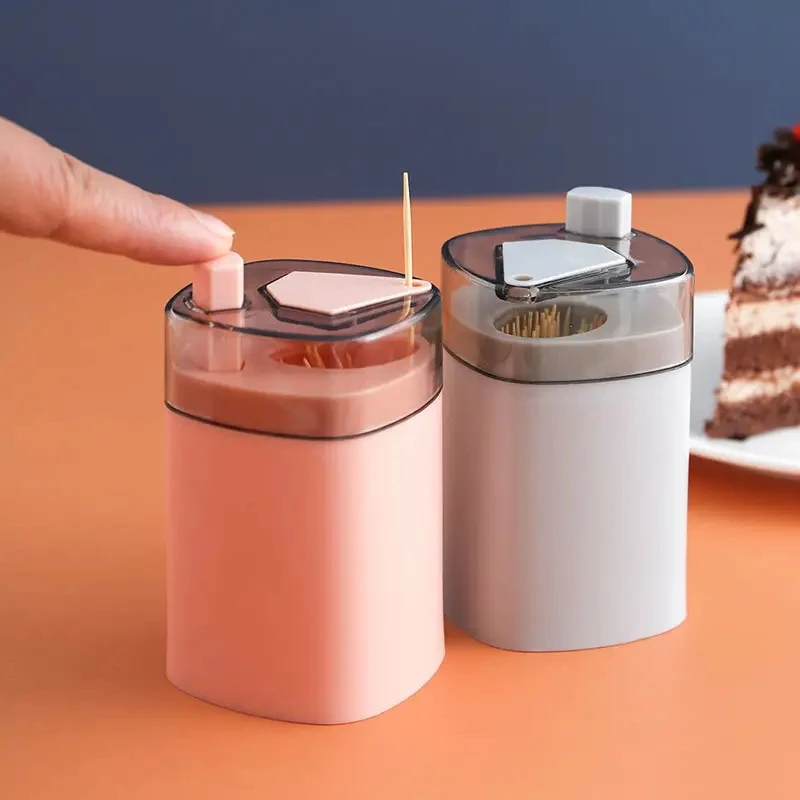 Creative automatic pop-up toothpick holder with press button suitable for restaurant and home use featuring a unique design