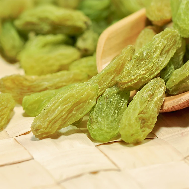 Premium seedless dried grapes Sweet green raisins Natural food product for all ages