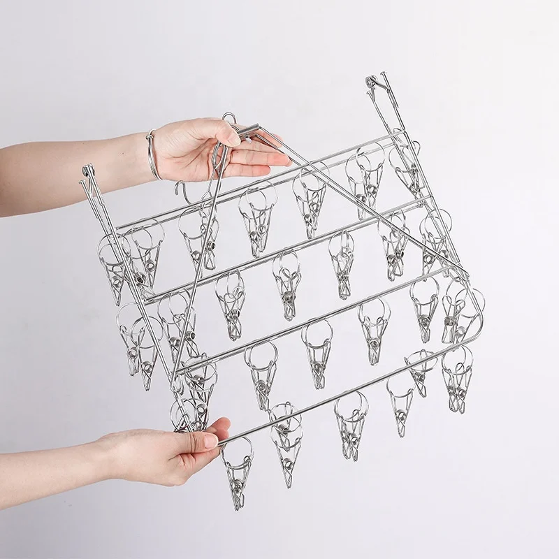 Space Saving folding Stainless Steel clothes Sock hanger and clothes Rack With 52 PEGS Laundry cloth peg Hanger magic pants hang