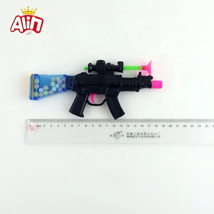 Toy gun contains mini ball fruit-flavored hard candy toy candy