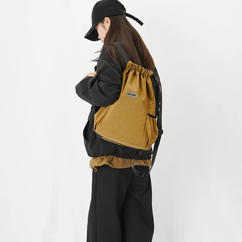 Lightweight casual fashion backpack beam mouth solid color sports backpack