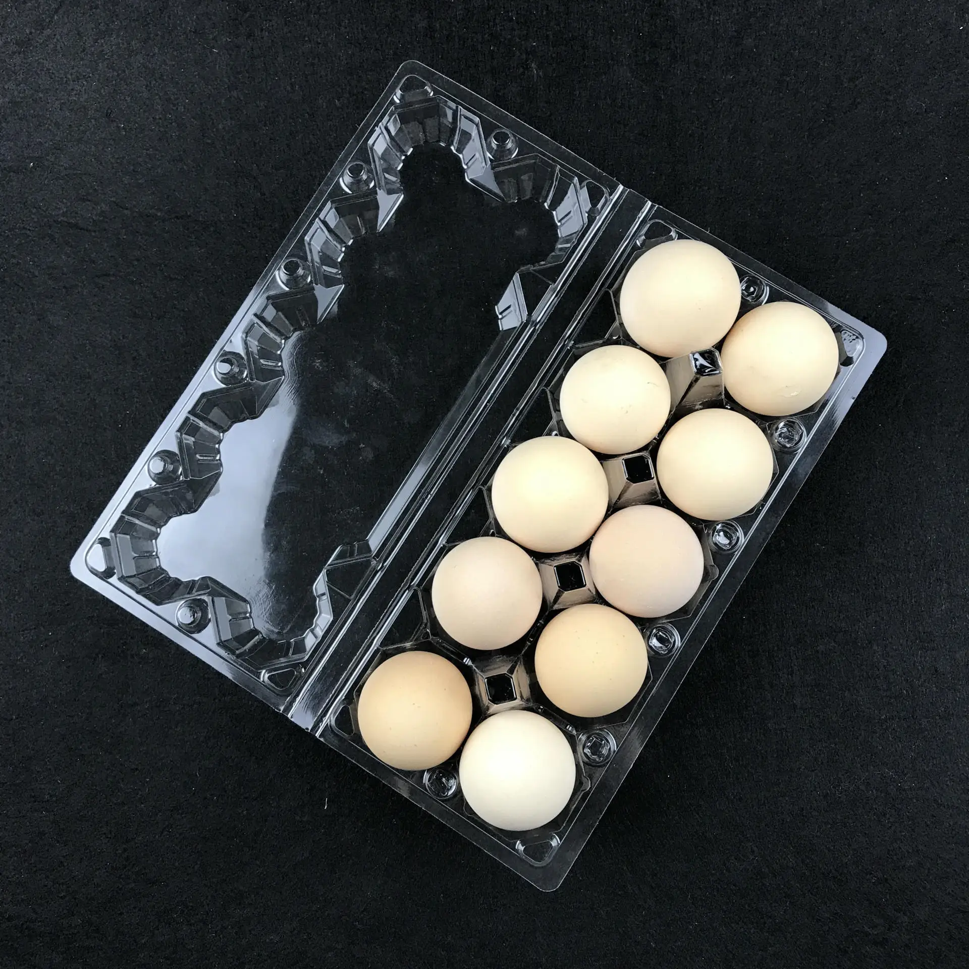 A plastic PET  egg trays egg box used by supermarkets to prevent eggs from breaking