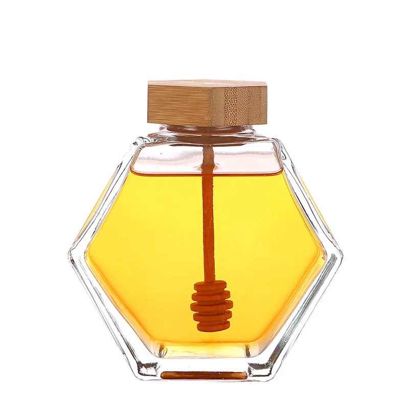 Wholesale cheap price and Customized 100ml 220ml 380ml Empty Clear Hexagonal Honey Jar Glass with Wooden Lid and Dipper