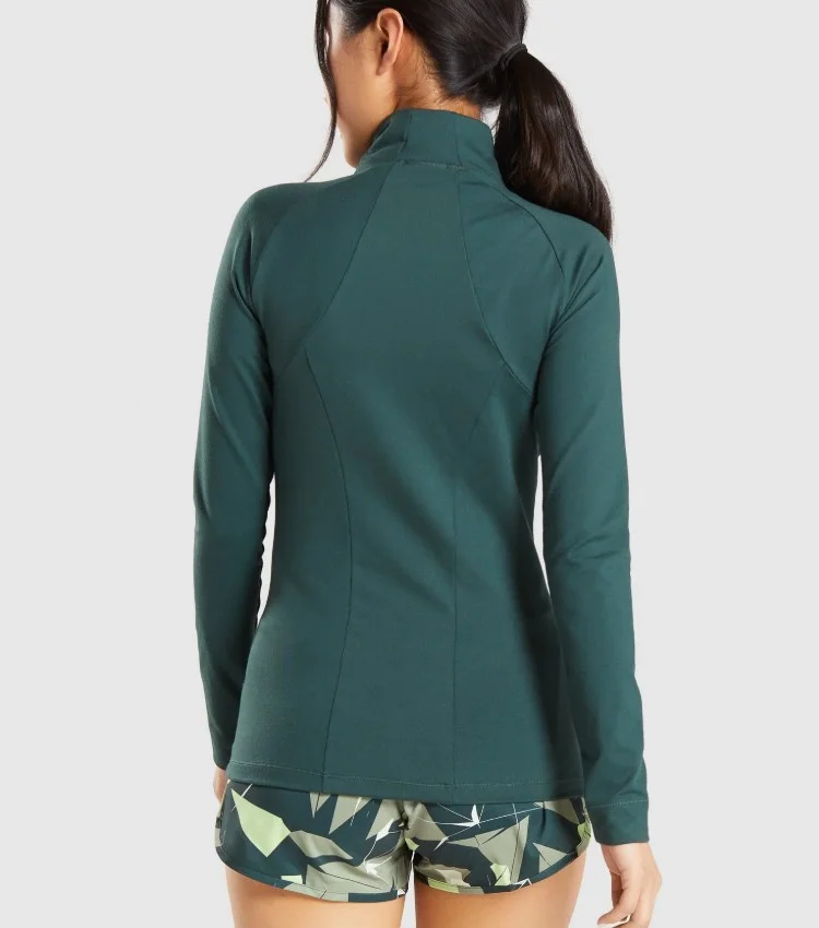 body fit nylon and spandex long sleeve high neck deep zipped pockets zip up ladies training sports athletic jacket women