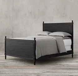 Custom furnished French style bedroom with large solid wood bed