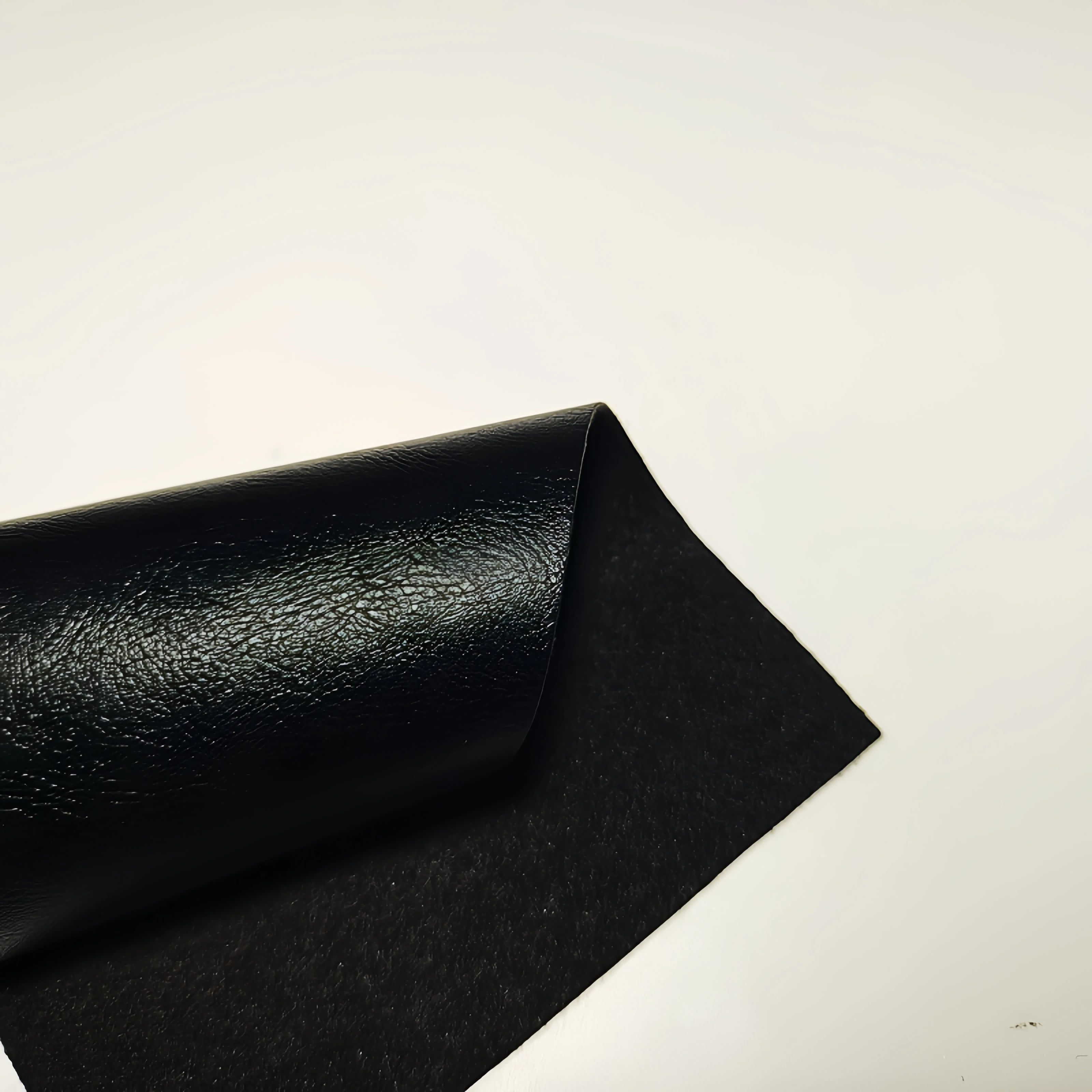 Black 0.9MM thick high-quality smooth fine sheepskin pattern PU synthetic leather fabric used for handbag, car seat material