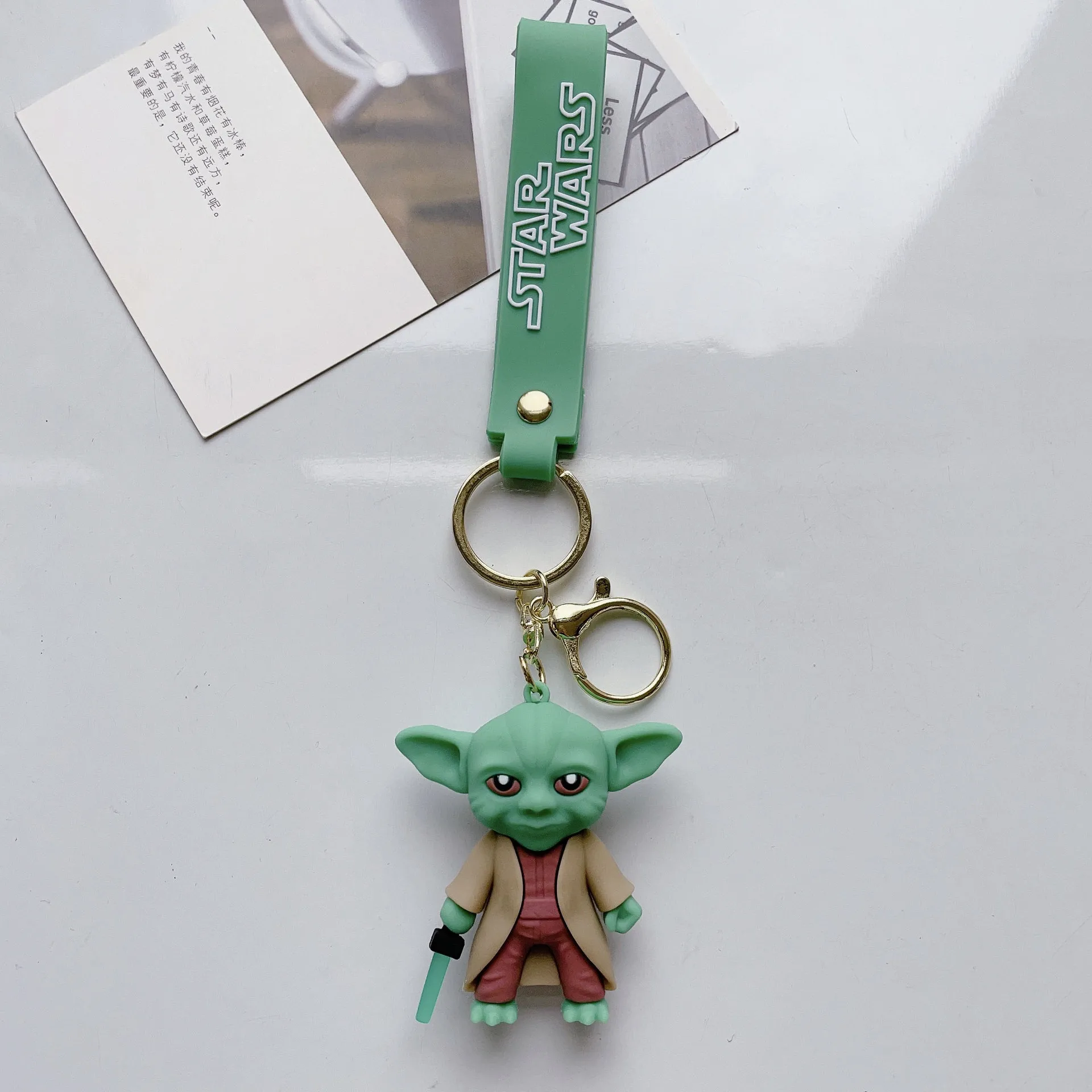 Cartoon Star Wars Keychain 3D Pvc Character Holding Weapon Cute Yoda Cool Keychain Pendant Decoration