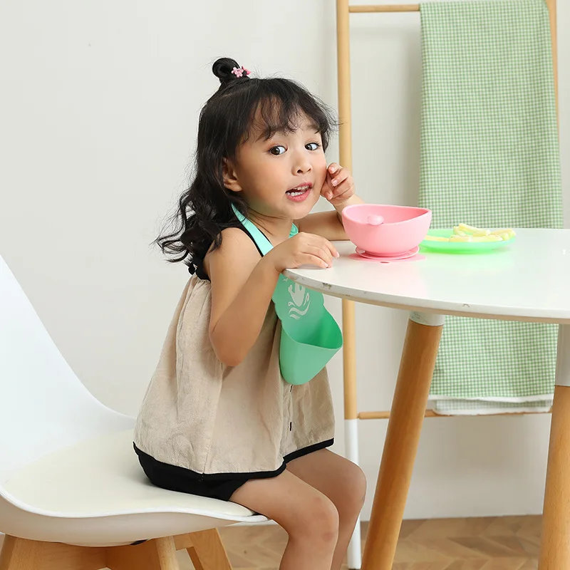 Manufacturers wholesale silicone baby baby meal bib super soft meal pocket children large saliva pocket wash-free
