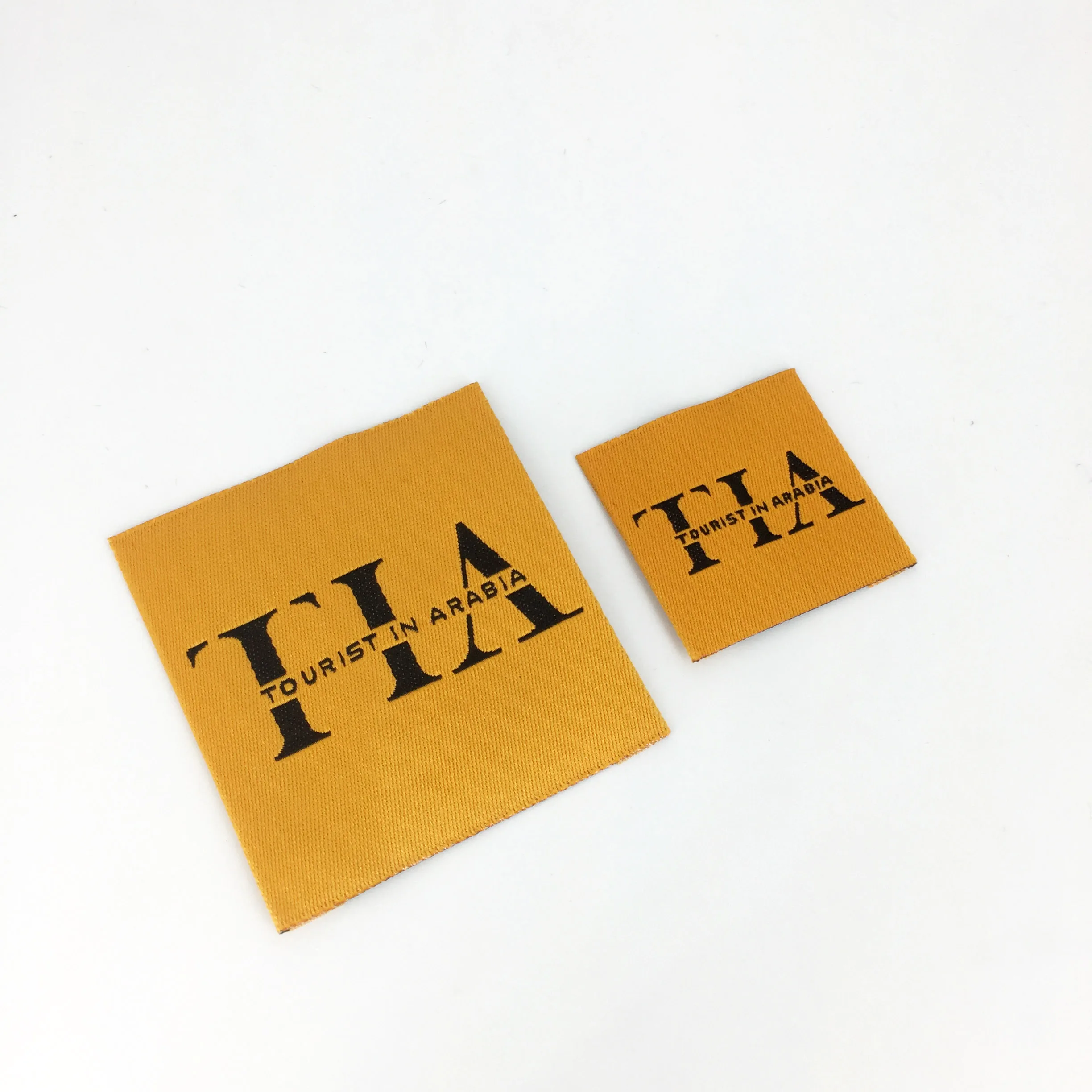 High density fashion design custom logo end fold black label swing on woven care label main tag for clothing socks