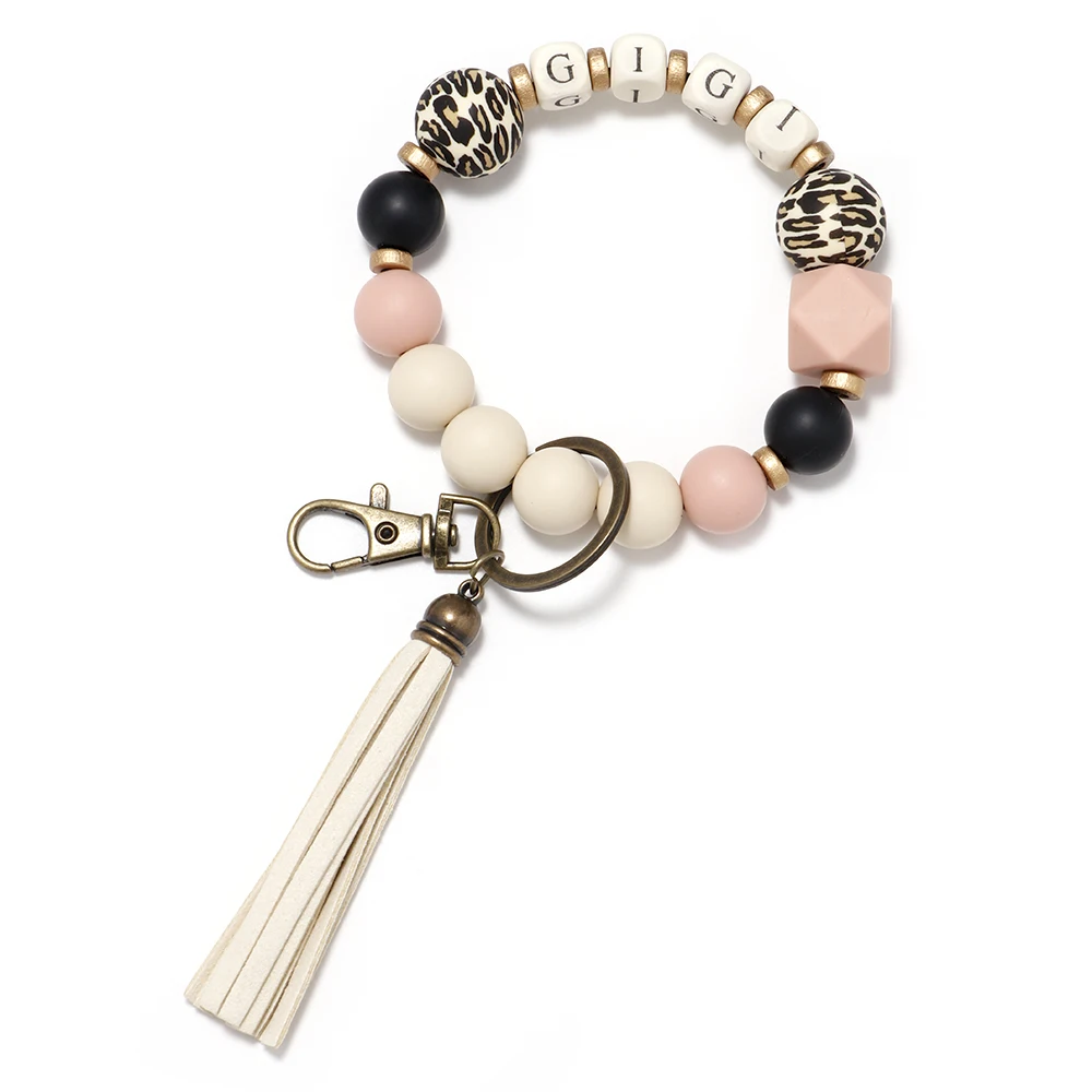 2022 Classic Popular Leather Tassel Wooden Bead Keychain Wholesale Bracelet Key Ring Silicone Bead Bracelet