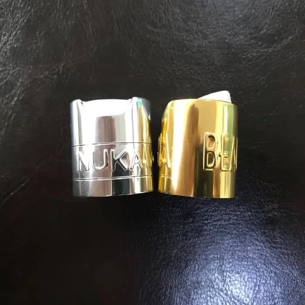 Shiny silver embossed aluminium logo plastic disc top cap