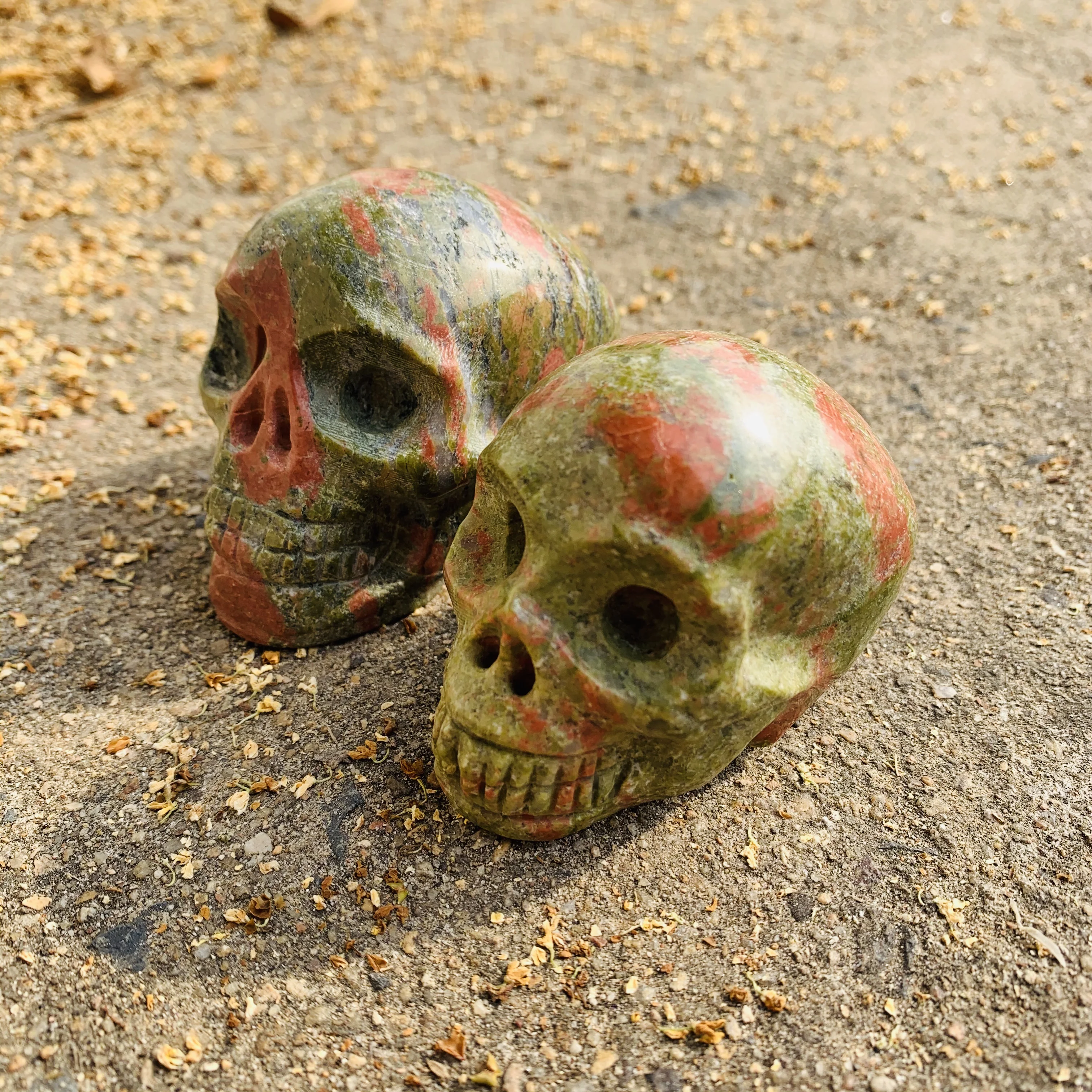 
wholesale hand carved natural epidote skulls red and green treasures quartz crystal skulls 