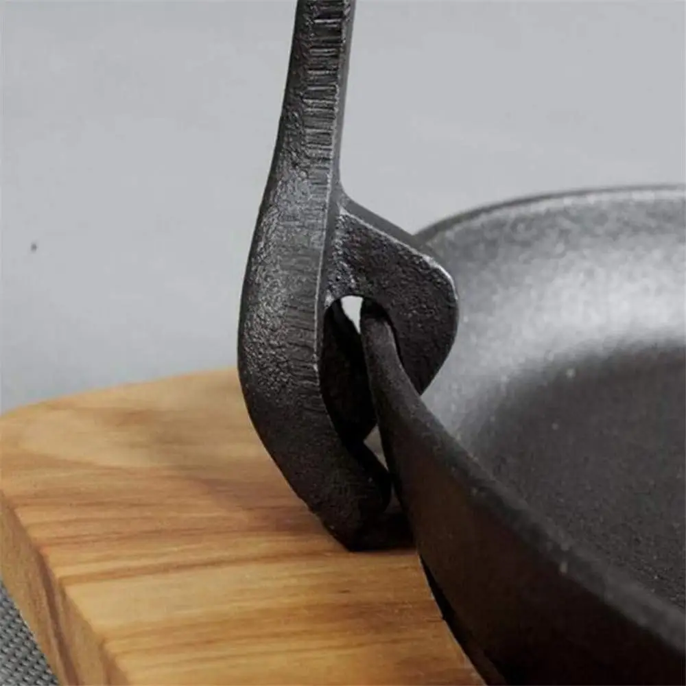 Cast iron frying pan with wooden board