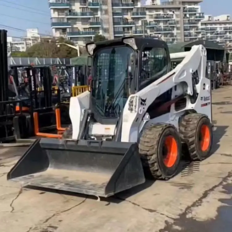 Подержанный высокомощный скользящий погрузчик Bobcat S750 с грузоподъемностью 1 4 тонн продается дешево а S70