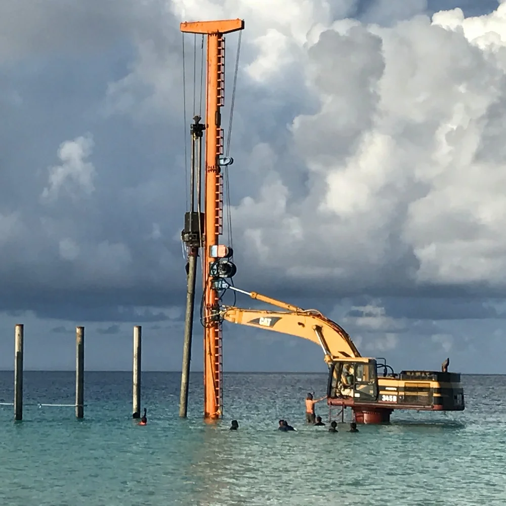 High bed excavator mounted pile driver with diesel pile hammer for resort or wharf project