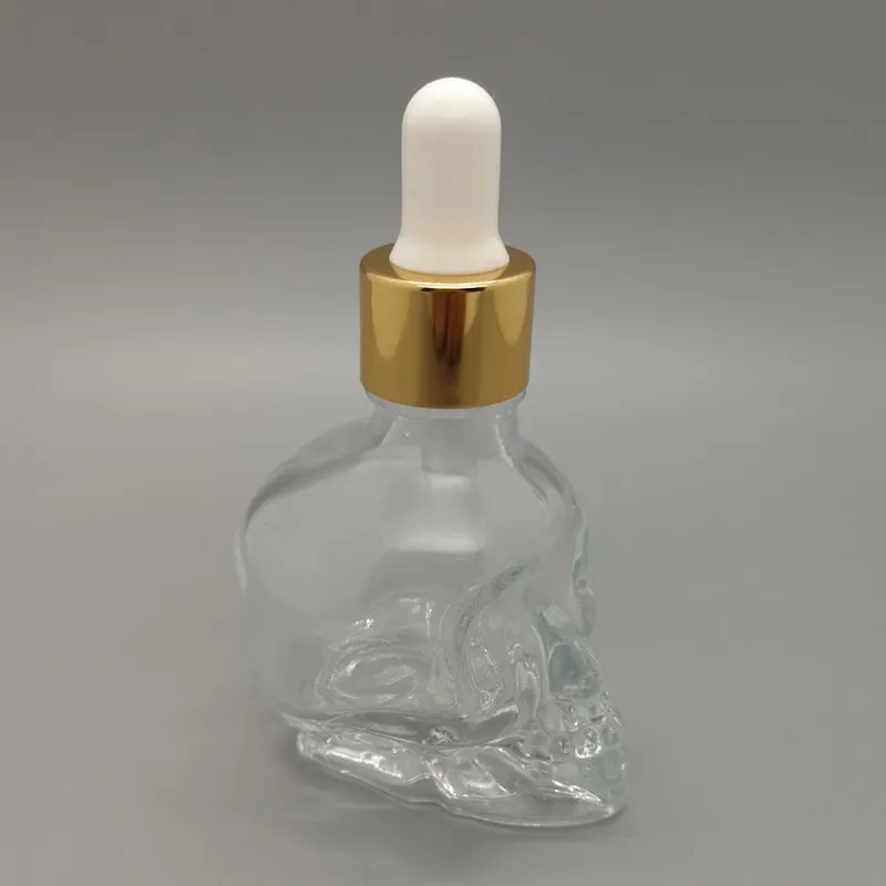 
Halloween gift 1oz skull shape glass dropper bottle for e liquid essential oil and beard oil bottle with gold topper 
