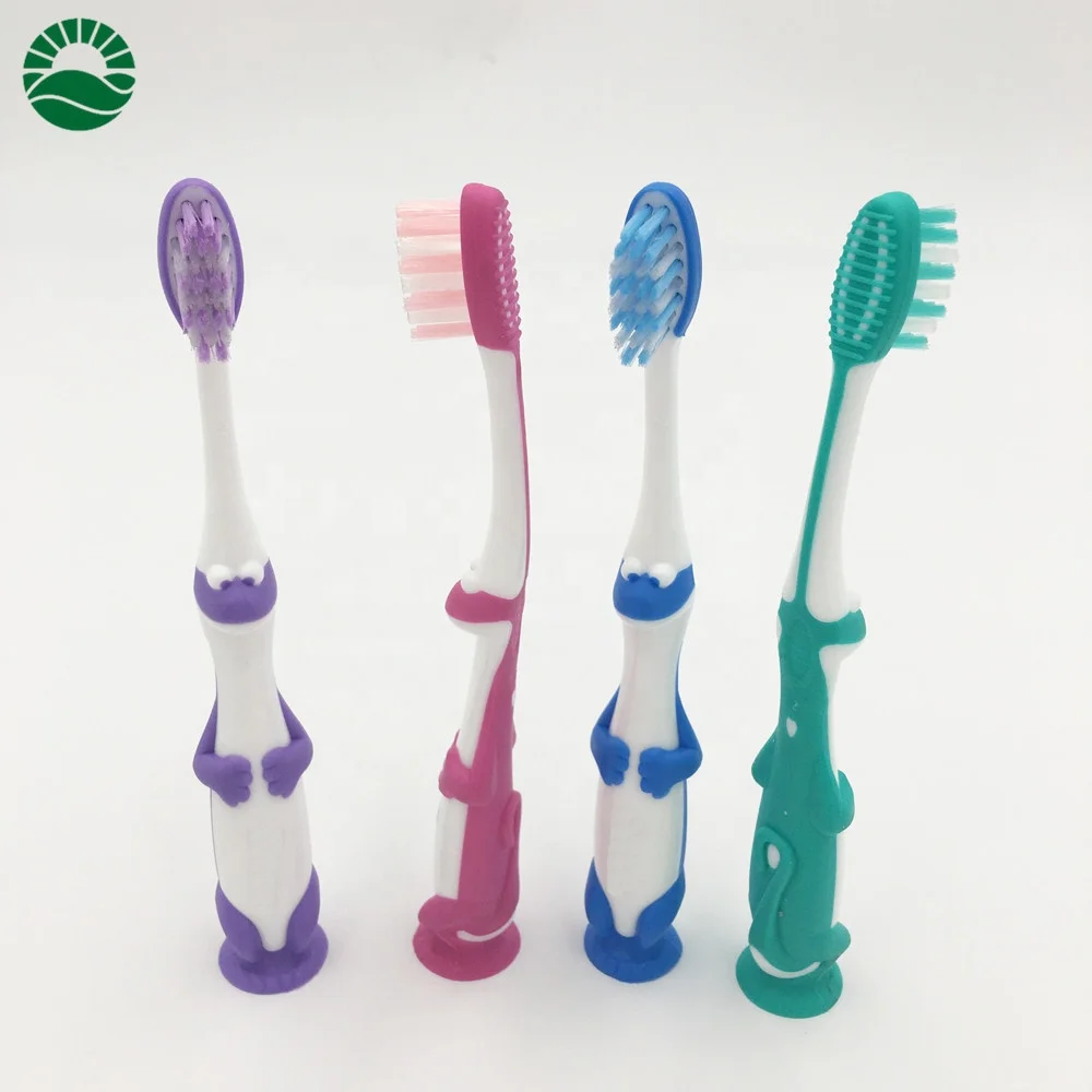 Cute dragon kids personalized toothbrush with suction bottom end round tooth brush