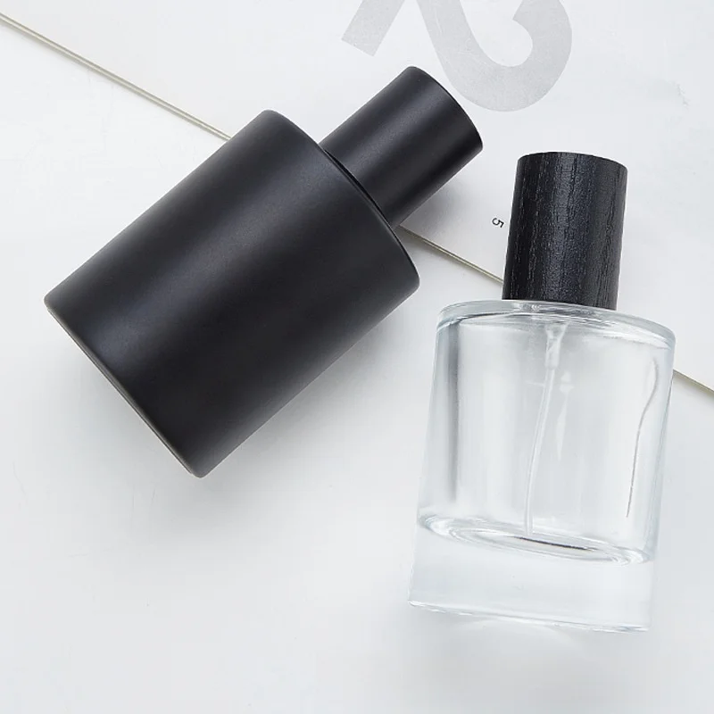 Wholesale Matte Black Glass Perfume Bottle 50ml Round Perfume Glass Bottle With Black Cap