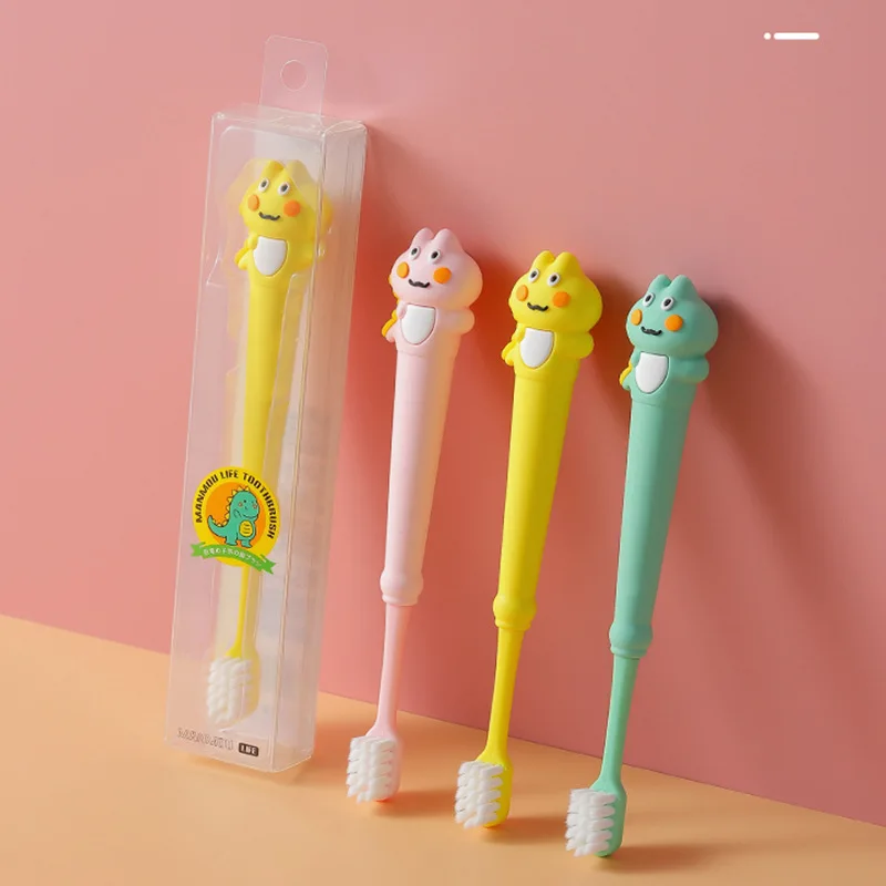 Wholesale Cute shape silicone BPA free crystal box cartoon dinosaur 0.12mm PBT soft bristles motel hotel kids child toothbrush