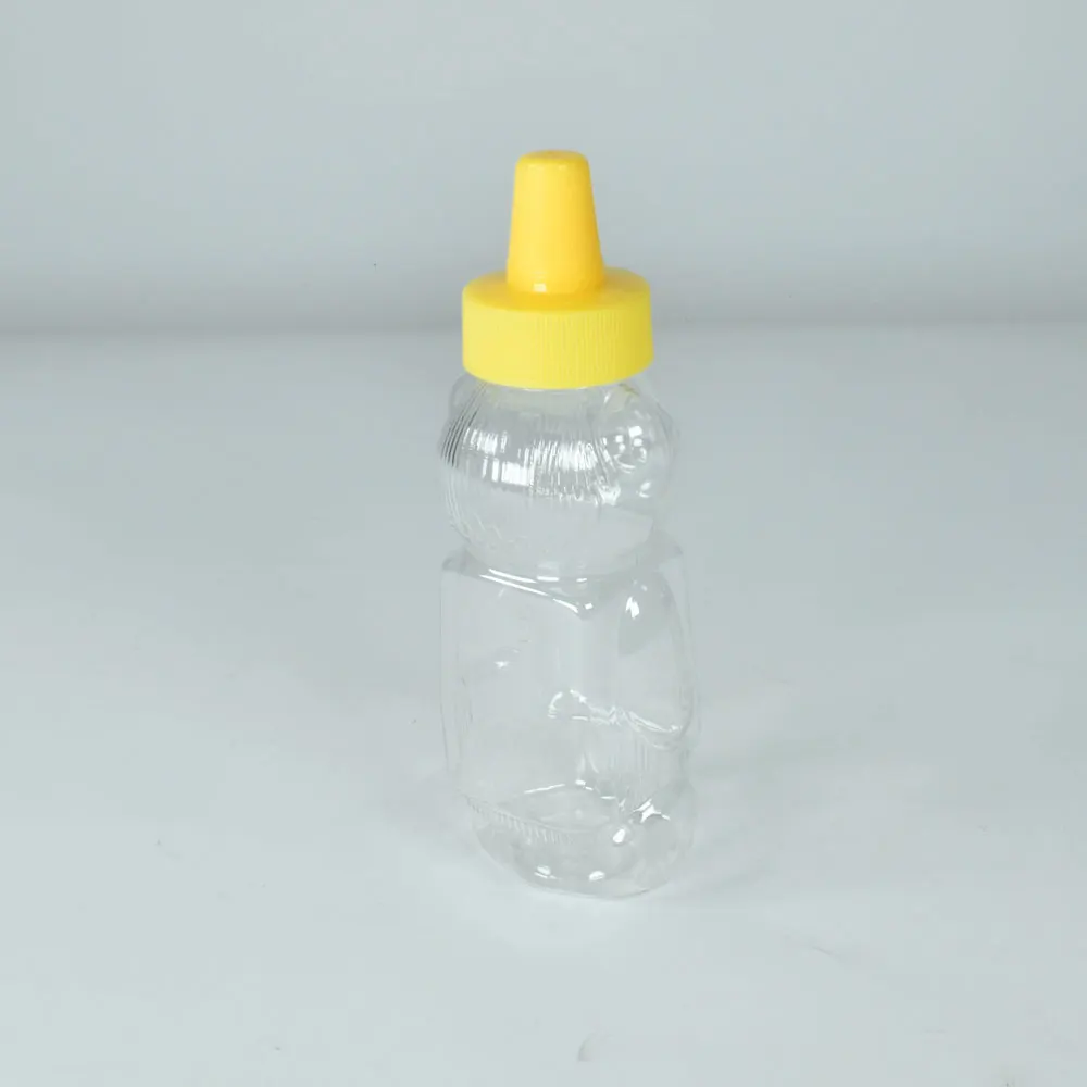 Unique animal bear shape squeeze plastic honey bottle pet material honey jars for sauce plastic container