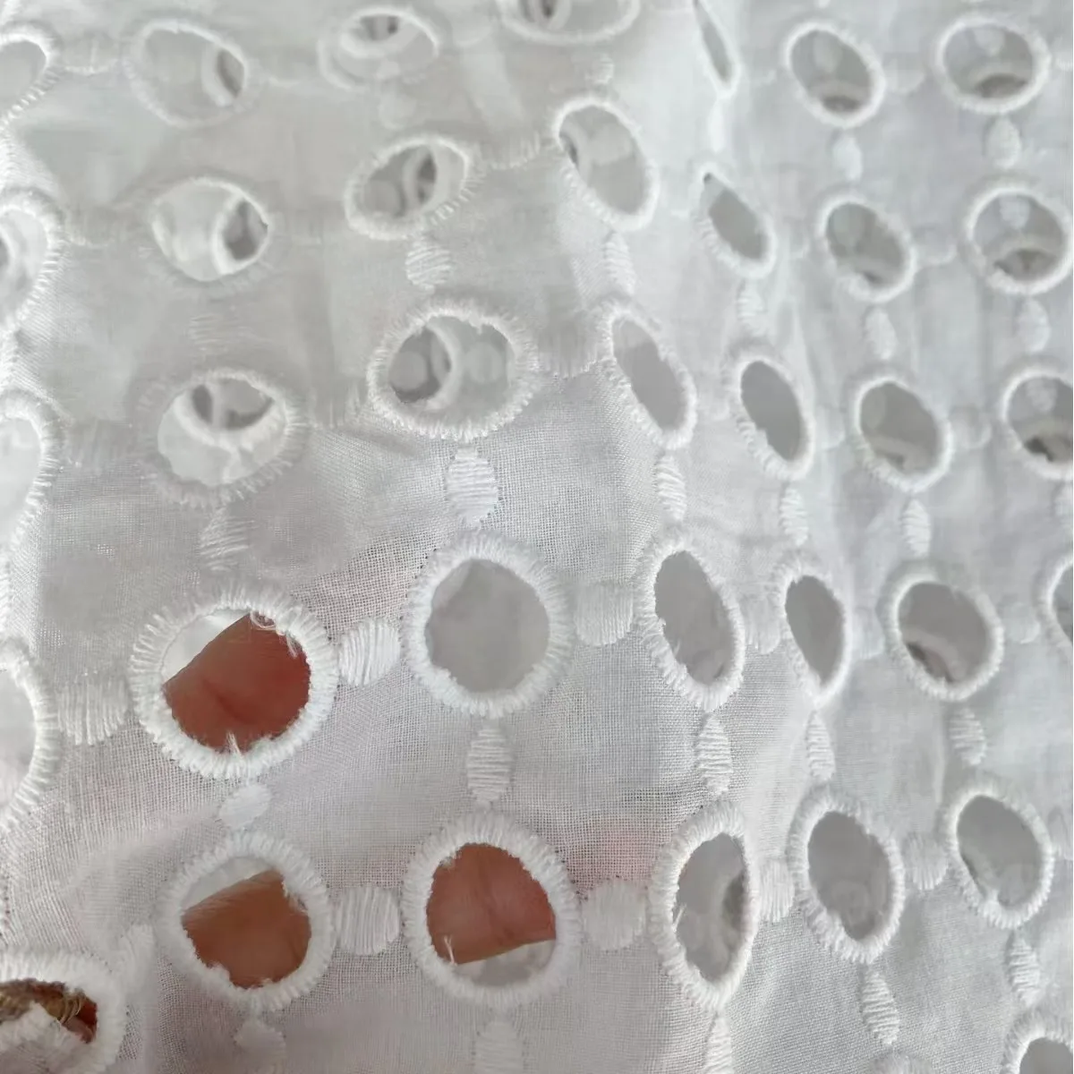 2024 New Design White 110gsm Lightweight Organic Cotton Eyelet Hollow Lace Embroidery Fabrics for Dress