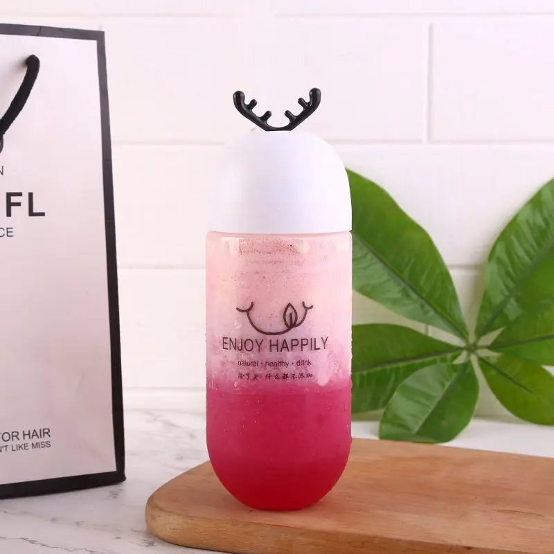 Hot Selling Capsule Shape Beverage Bottle Personalized Antler Stopper Transparent Plastic Bottle Creative Juice Bottle
