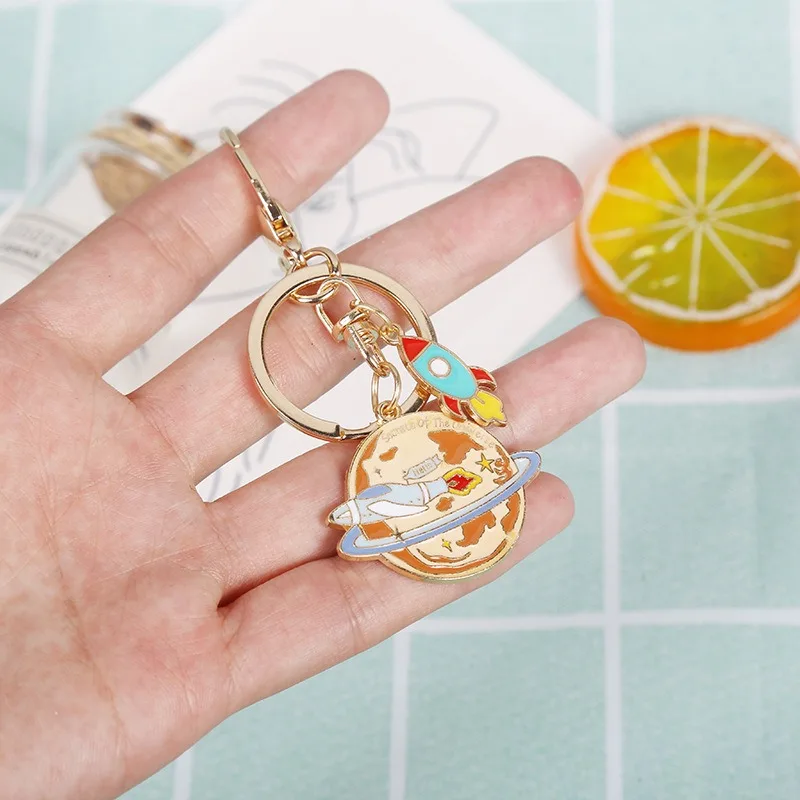Wholesale Cute Cartoon Students Metal Keychain Bag Car Key Pendant Alloy Universe Starry Sky Rocket Astronaut Keychain