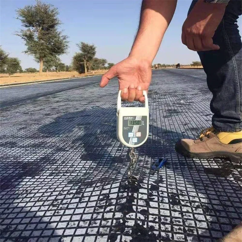 30 60 150KN Bitumen Coating Road  Fiberglass Geogrid Asphalt Reinforcement asphalt coated fiberglass geogrid composite geotex