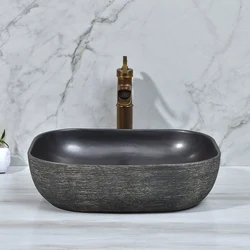 Wholesale hand carved double layer design black color art porcelain oval shape washroom wash basin
