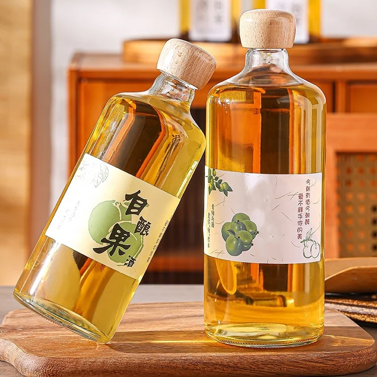 Top-ranking Products 500ml 700ml Transparent Round Glass Liquor Wine Vodka Tequila Bottle With Sealed Cork