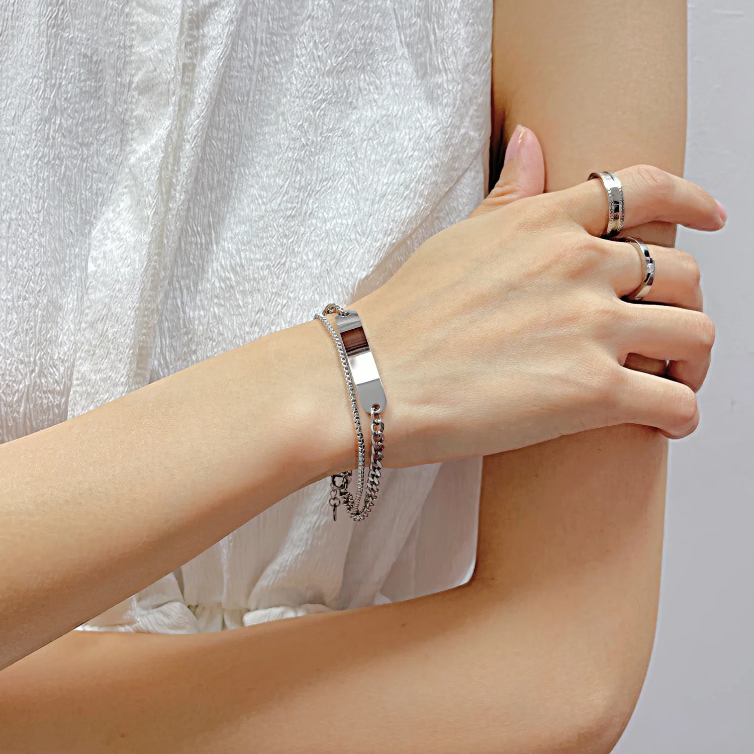 Fashionable titanium steel double chain bracelet, stainless steel long curved plate with customizable logo bracelet for women