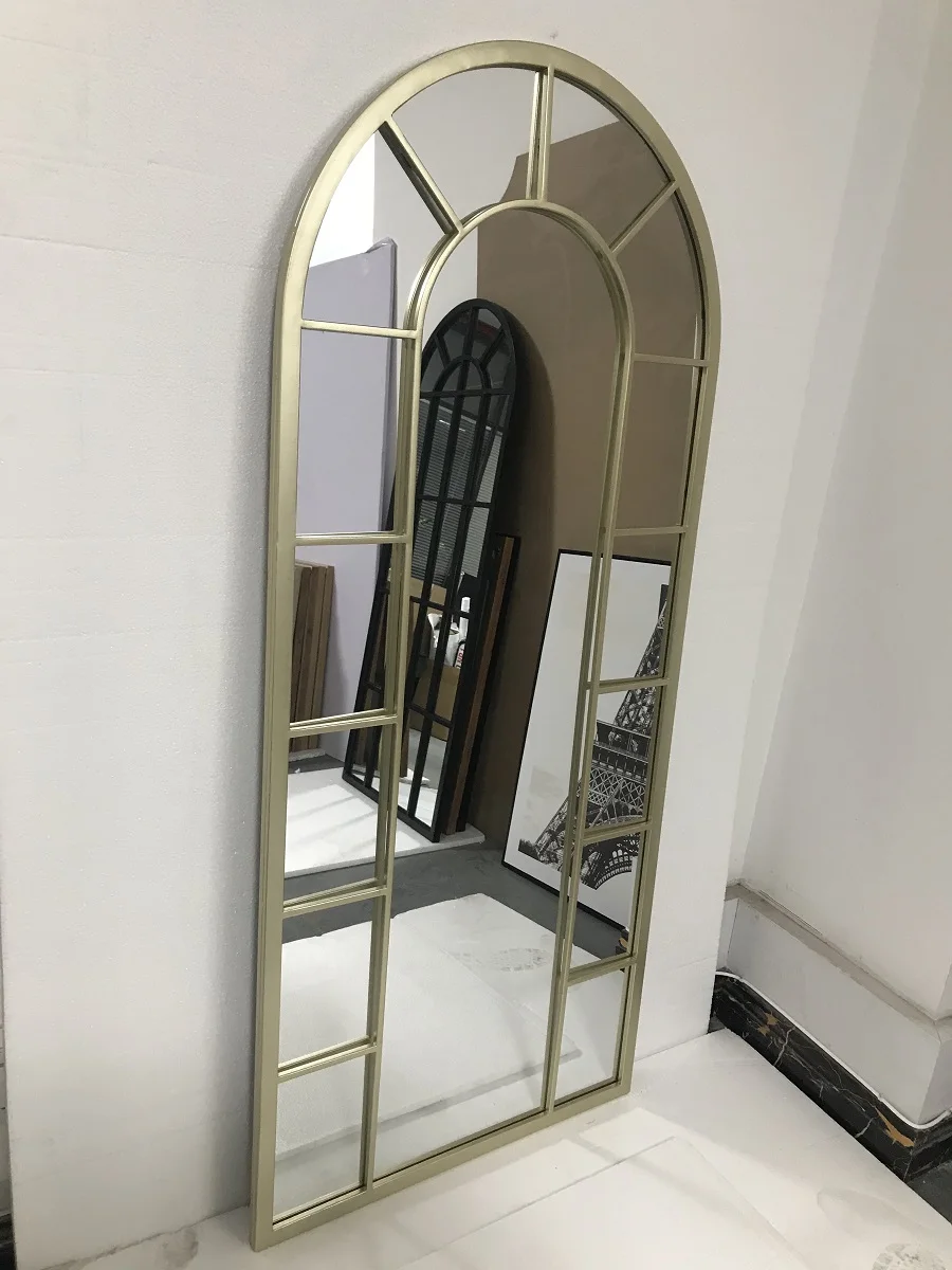 large arched full-length metal floor standing dressing mirror