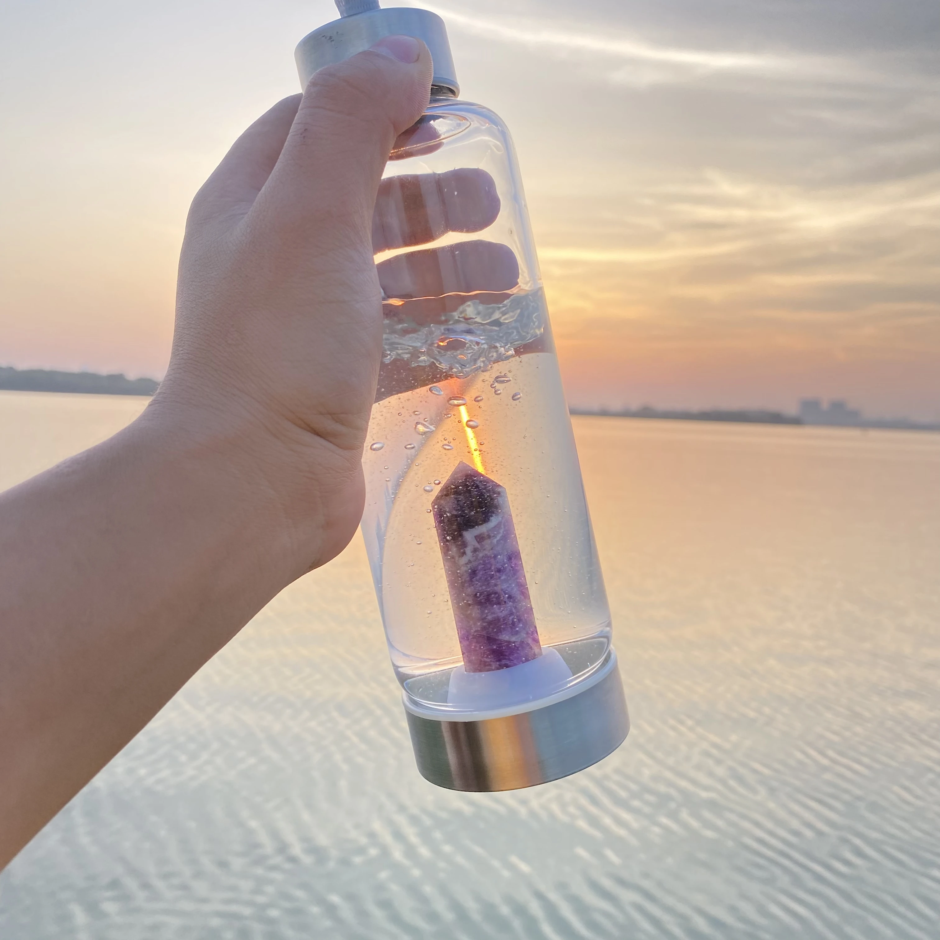 Glass Water Bottle With Rose Quartz Crystal on the Bottom