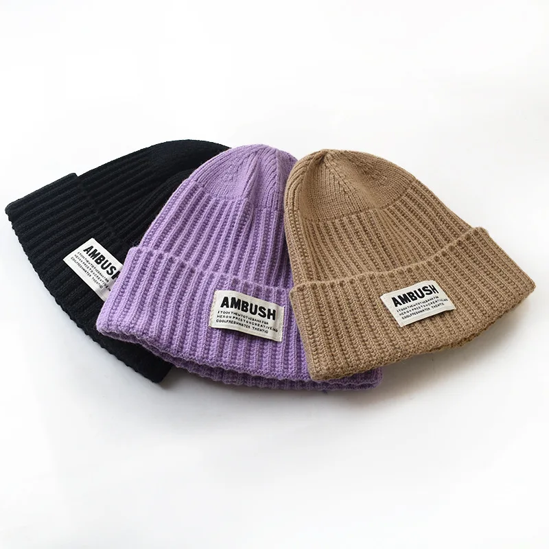 Hot sale wholesale knitted hat with custom logo knitted ear protection warm hat with cloth label for unisex