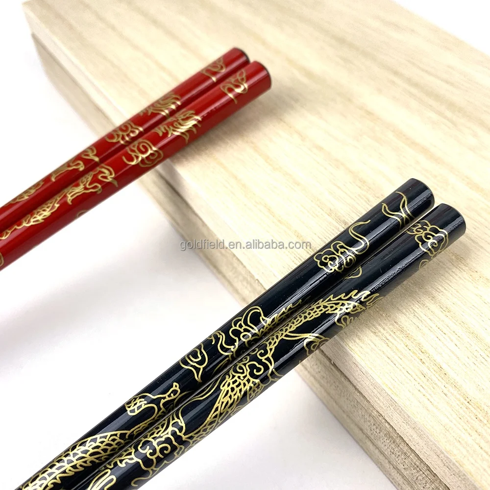 high-end golden dragon wood chopsticks with elegant golden moon stainless steel holders for restaurant