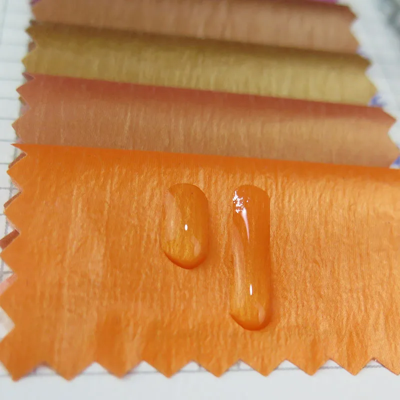 wholesale woven plain style Metallic shiny skin feel anti-static waterproof nylon fabric for coat down jacket, clothes