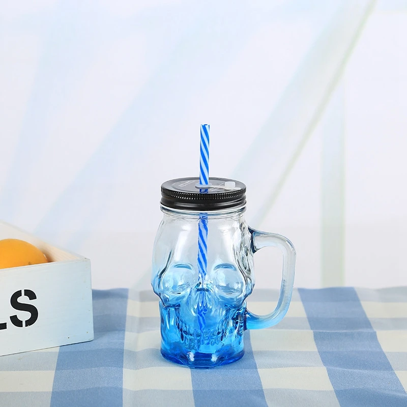 Custom Color Food Grade Skull Shape Wide Mouth Glass Mason Jar with Lids Straw Handle for Beverage Juice Container