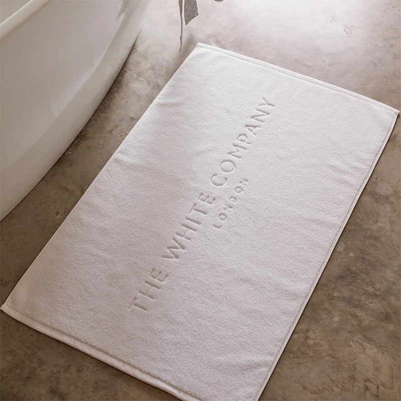 Оптовая продажа, пользовательский Жаккардовый Логотип, нескользящий белый Хлопковый махровый коврик для ванной для отеля, спа, ванной