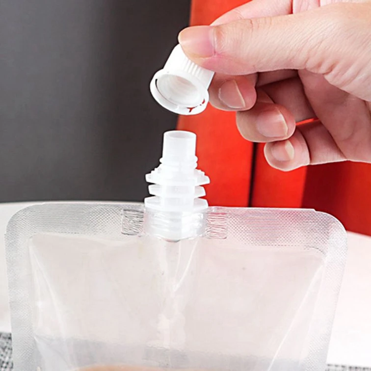 Automatic spout pouch filling and capping machine for packing bag liquid water milk oil beverage juce paste cream honey sauce