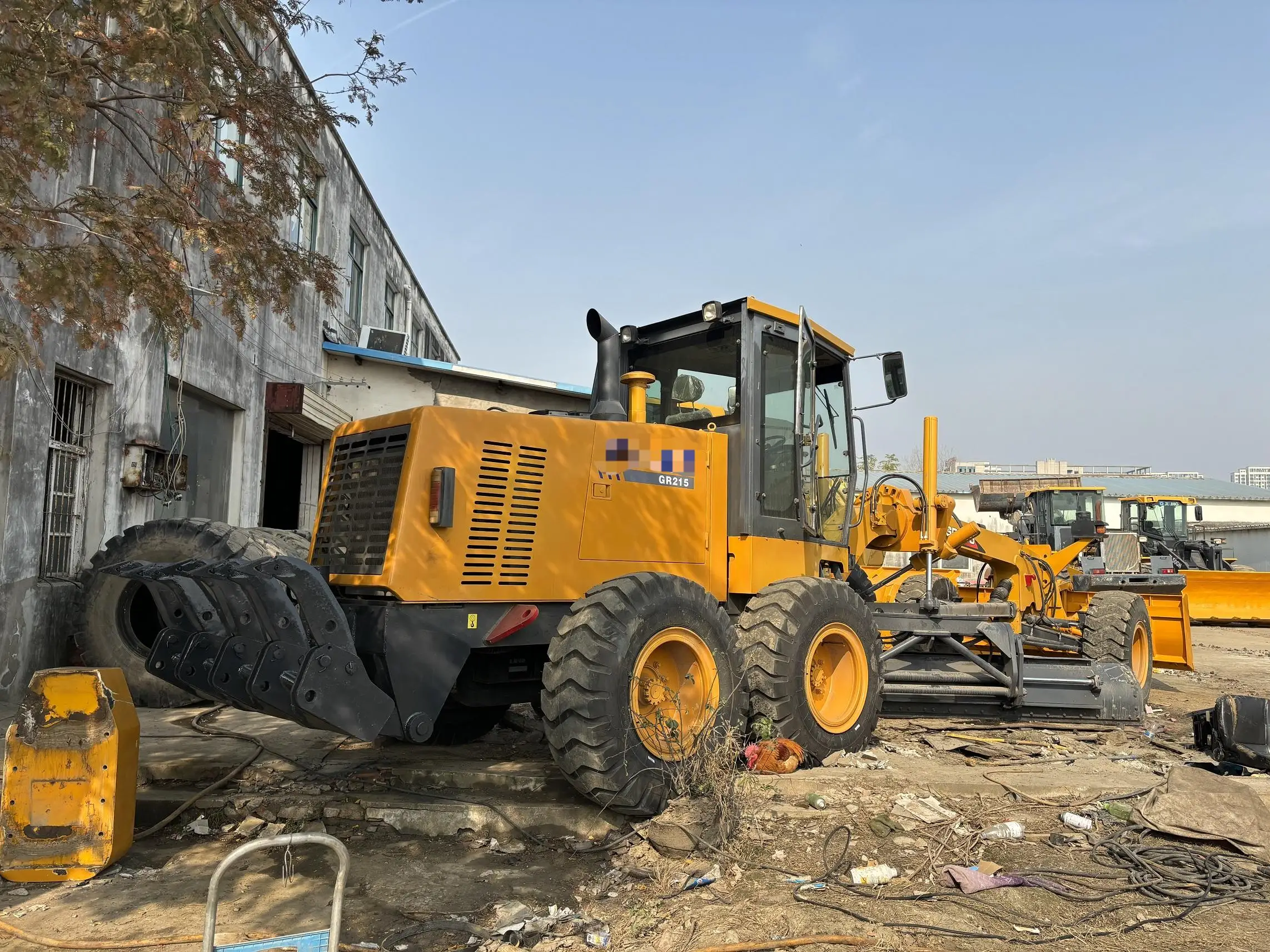 China cheap  on the stock GR215 tractor road grader wheel-type grader with low price